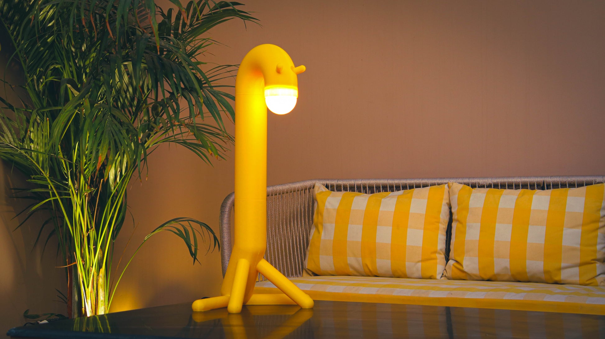 Unique giraffe-inspired 3D printed table lamp displayed in a stylish modern living room