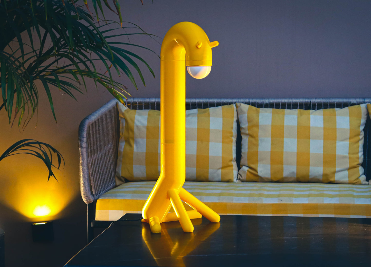 Unique giraffe-inspired 3D printed table lamp displayed in a stylish modern living room.