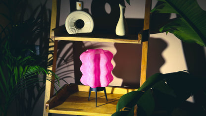 Cordless portable table lamp, light pink wave pattern, styled with plants