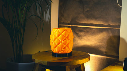 Quilted puffer-style table lamp, orange finish, cylindrical shape
